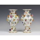 A large pair of Meissen porcelain fruit and flower encrusted vases, 19th century, the basketweave