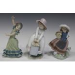Three Lladro porcelain figures, comprising Lolita, No. 5192, Sweet Scent, No. 5221, and Springtime