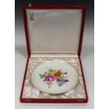 A Meissen porcelain cabinet plate, 20th century, painted with flowers within a gilt line border,