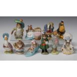 Ten Beswick Beatrix Potter figures, comprising 'Benjamin Bunny' and 'Hunca Munca', gold oval