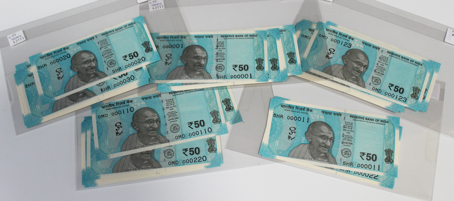 A collection of India fifty rupee banknotes.Buyer’s Premium 29.4% (including VAT @ 20%) of the