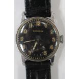 A Longines steel fronted and base metal backed circular wristwatch, the signed black dial with