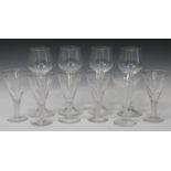 A set of five Stuart wine glasses, each conical bowl engraved with a thistle and raised on an