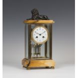 A late 19th century French lacquered brass and Sienna marble four glass mantel clock, the eight