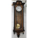 A late 19th century walnut and ebonized cased Vienna style wall clock with eight day movement