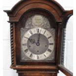 A George V oak diminutive longcase clock with eight day movement chiming on gongs, the breakarch