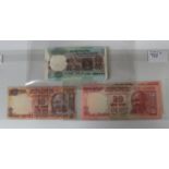 A collection of Indian banknotes, including a consecutive run of one hundred five rupees, stapled,