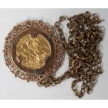 A Victorian Young Head sovereign 1876 in a 9ct gold pendant mount, decorated with a scroll pierced