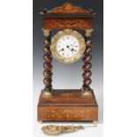 A 19th century French rosewood portico clock with eight day movement striking on a bell via an