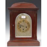 An early 20th century German mahogany cased mantel clock with Junghans eight day movement chiming on
