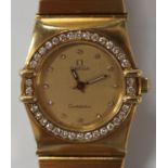 An Omega Constellation 18ct yellow gold and diamond set lady's bracelet wristwatch, the signed