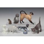 Six Royal Copenhagen porcelain animals, including drake, No. 119, pig, No. 1400, cat with tail up,