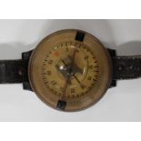 A German AK39 pilot's wrist compass, the circular case with clear plastic dial, the case back