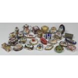 A large collection of assorted porcelain trinket and snuff boxes, late 20th century, most in an