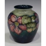 A Moorcroft pottery Clematis pattern vase, circa 1946-75, painted initials and impressed marks to