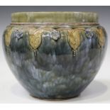 A Royal Doulton stoneware jardinière of bulbous shape, covered in a streaked green glaze, a