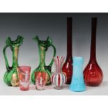 A mixed group of coloured glassware, late 19th and 20th century, including a cranberry Jack in the