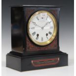 A late 19th century French Egyptianesque slate mantel clock with eight day movement striking on a