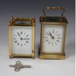 An early 20th century French brass cased carriage timepiece with glazed case and swing handle,