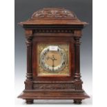 An early 20th century German stained beech mantel clock with eight day movement chiming and striking