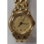 A Chaumet Paris 18ct gold and diamond set lady's bracelet wristwatch, the signed textured gilt
