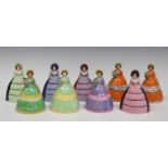 Nine Carlton Ware novelty crinoline lady napkin rings, including two matching pairs, heights ranging