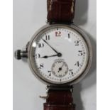 A Longines silver circular cased gentleman's wristwatch with a signed jewelled movement, the