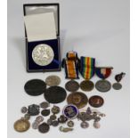 A group of coins, medals and medallions, including a British War Medal and Victory Medal to '562784.