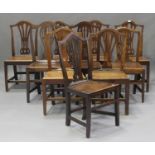 A harlequin set of ten George III provincial elm pierced splat back dining chairs, all with solid