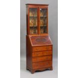 An Edwardian mahogany and satinwood crossbanded narrow bureau bookcase, the moulded pediment above a