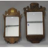 A 20th century George III style walnut wall mirror with a fretwork frame and gilded shell motif,