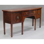An early 20th century George III style mahogany bowfront sideboard, fitted with a cupboard and two