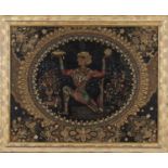 A late 19th/early 20th century gilded and coloured scrolled paper panel, finely worked with
