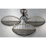A set of three 20th century wrought iron wall mounted hay racks, width 80cm, together with an