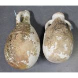 Two Mediterranean earthenware amphora type oil jars, lengths 56cm and 47cm.Buyer’s Premium 29.4% (