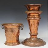 An Arts and Crafts style copper wine cooler, the tapering body worked with grapes and vine leaves,