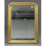 A 19th century gilded arch framed wall mirror with banded decoration, 90cm x 65cm.Buyer’s Premium