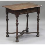 An early 18th century oak side table, fitted with a single frieze drawer, raised on turned legs