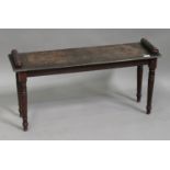A Victorian oak window seat with turned handles, raised on turned legs, height 46cm, width 93cm,