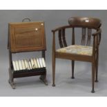 An Edwardian mahogany tub back armchair with inlaid decoration, the upholstered seat raised on