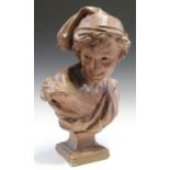 After Jean-Baptiste Carpeaux - a terracotta coloured plaster head and shoulders portrait of