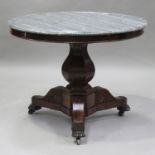 A French Empire mahogany and grey marble topped circular centre table, raised on a baluster