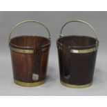 A near pair of 18th century Irish mahogany plate buckets with brass mounts and swing handles, height