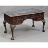 An early 20th century George III style mahogany writing table, the top inset with a black leather