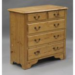 A 20th century pine chest of two short and three long drawers, on bracket feet, height 95cm, width