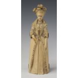 A 19th century Dieppe carved ivory full-length figure of Marie Antoinette, her body double-hinged