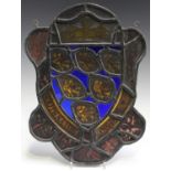 A 19th century stained and leaded glass panel of shaped form, worked as a crowned crest and