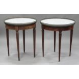 A near pair of French mahogany circular occasional tables, each inset with a white marble top