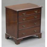 An early 20th century George III style mahogany chest of four graduated long drawers, on bracket