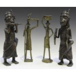 A pair of 20th century African dark patinated bronze Benin style figures, height 34cm, together with